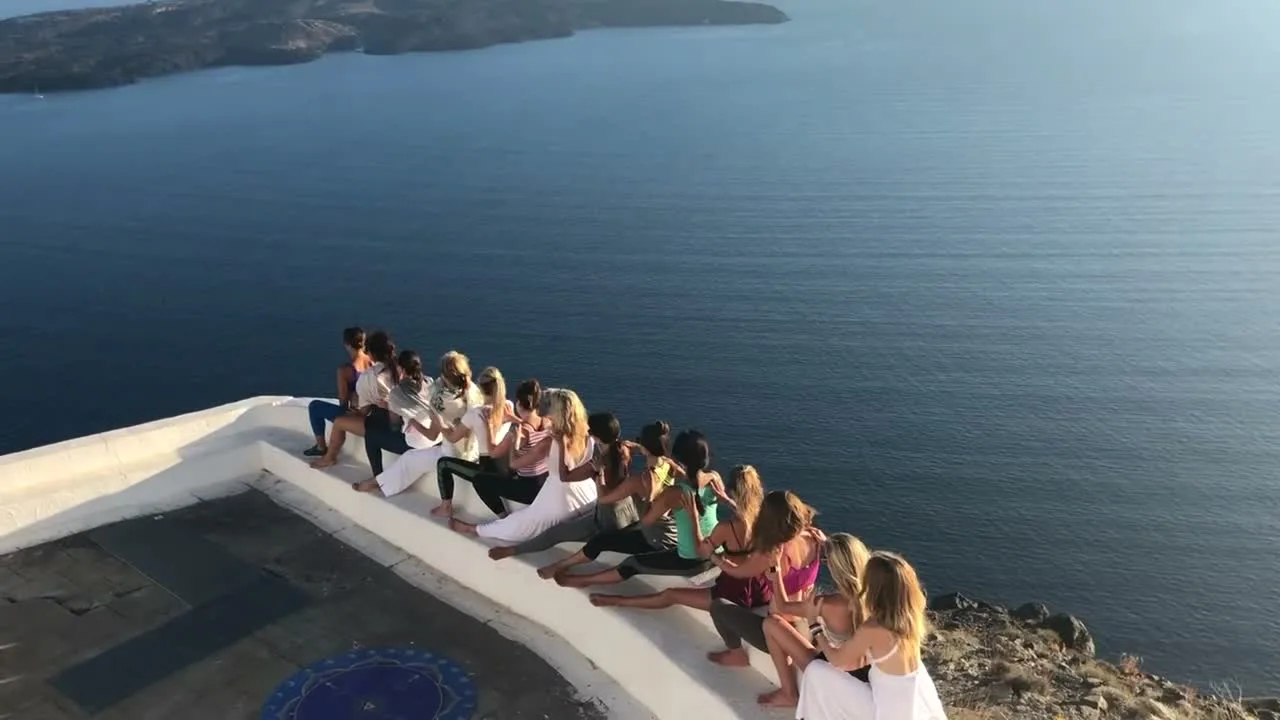 Teacher's Path students gathered above the sea in Greece