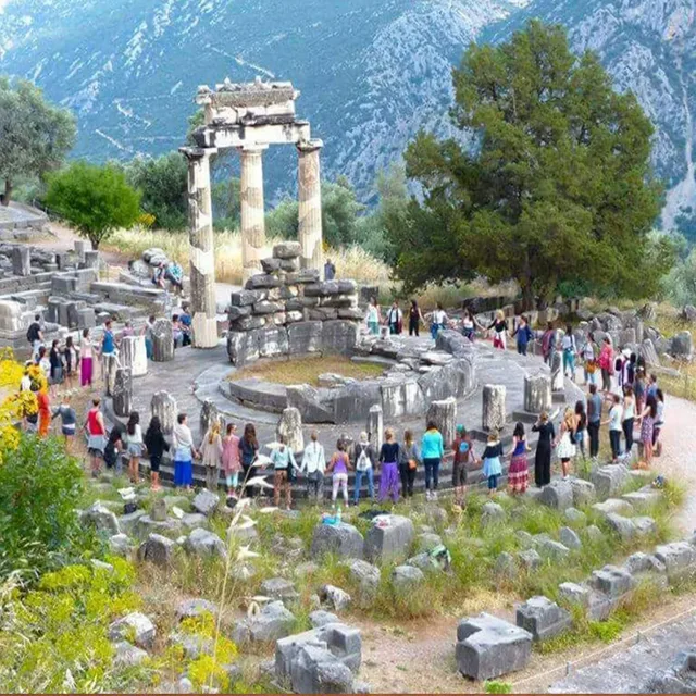 Women in circle among the ancient temples of Delphi