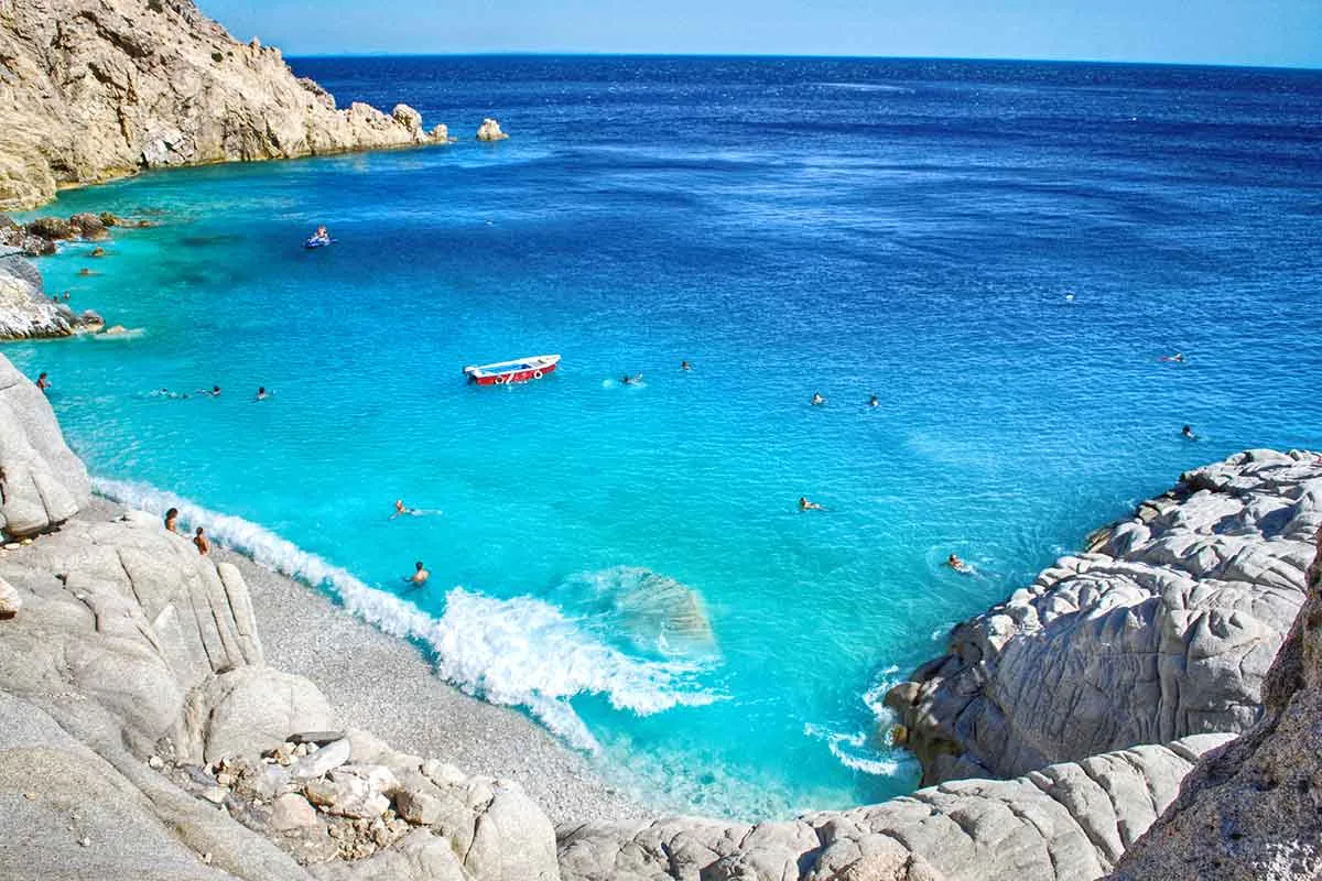 Seychelles Beach, Ikaria - turquoise water between white rocks