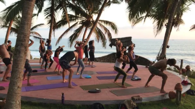 Yoga under the palms by the Indian Ocean, Malabar Coast
