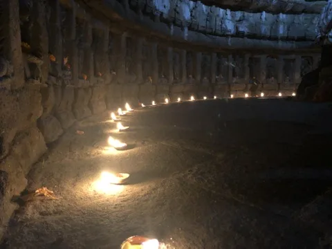 Temple oil lamps at dusk