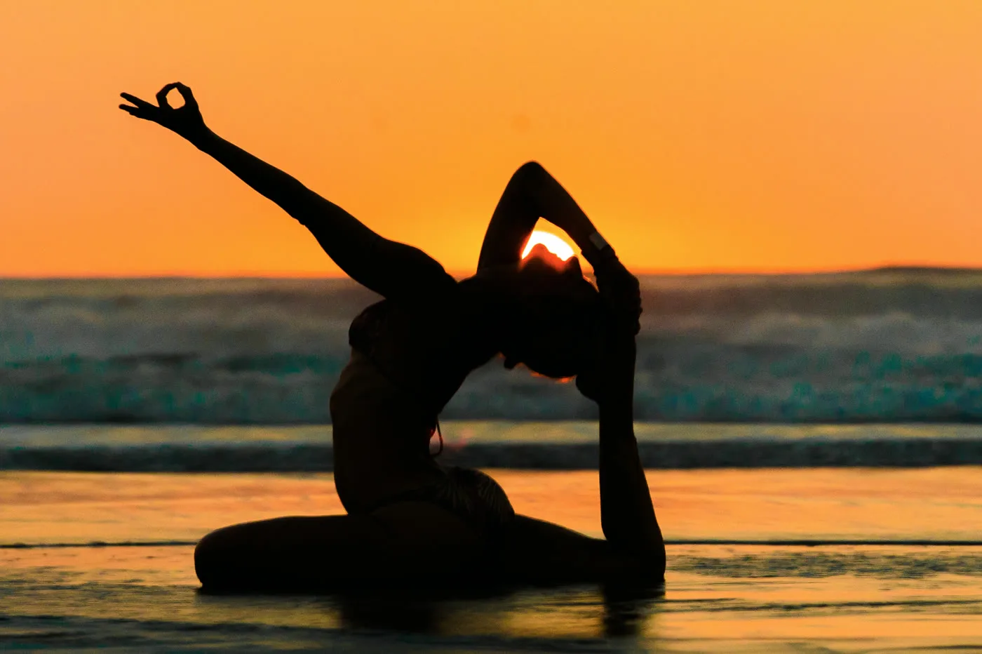 Shiva practicing a solar asana at sunset